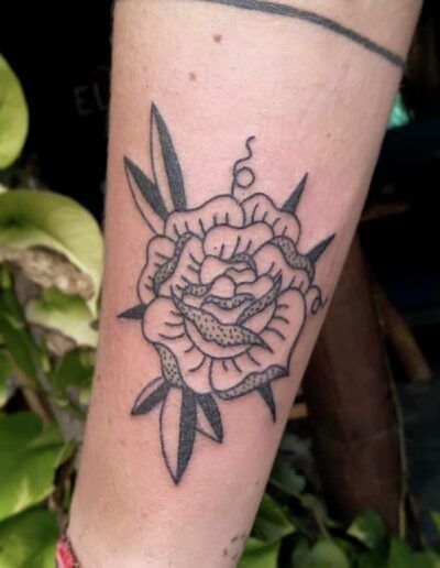 traditional flower handpoke tattoo in wellington